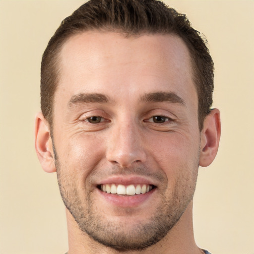 Joyful white young-adult male with short  brown hair and brown eyes