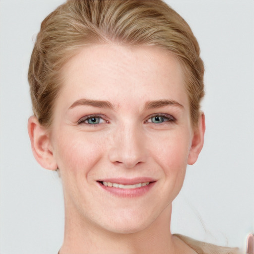 Joyful white young-adult female with short  brown hair and blue eyes