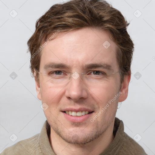 Joyful white adult male with short  brown hair and grey eyes