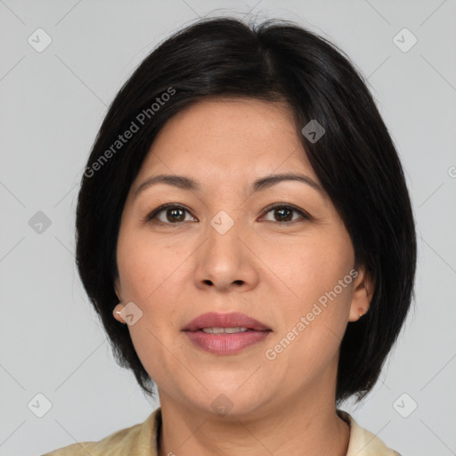 Joyful asian adult female with medium  brown hair and brown eyes