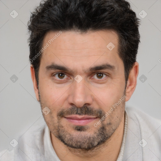 Joyful white adult male with short  black hair and brown eyes