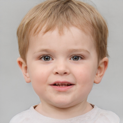 Joyful white child male with short  brown hair and blue eyes