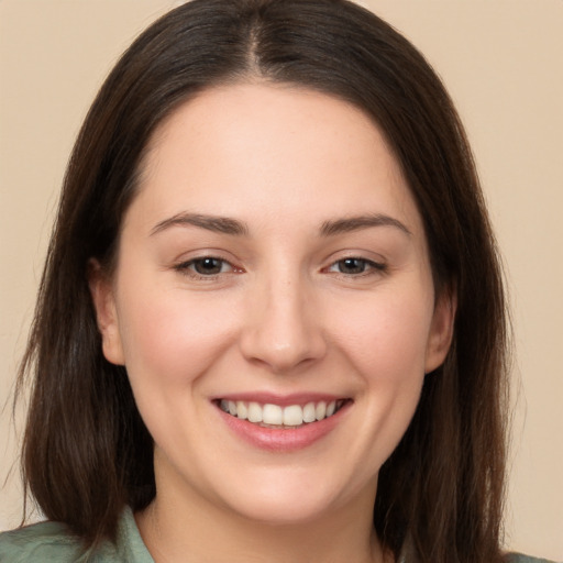 Joyful white young-adult female with medium  brown hair and brown eyes