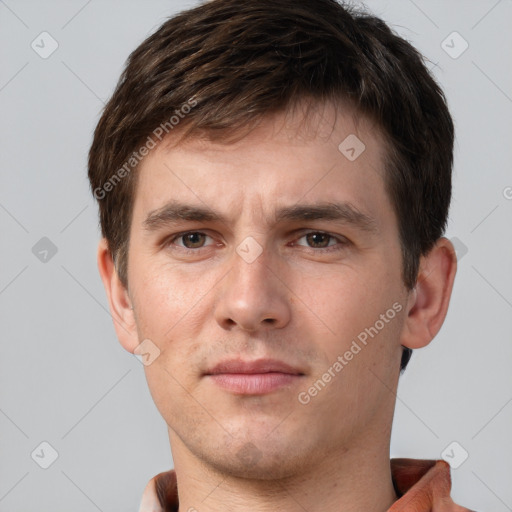 Neutral white young-adult male with short  brown hair and brown eyes