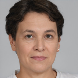 Joyful white adult female with short  brown hair and brown eyes