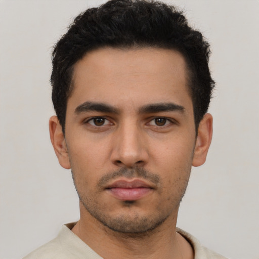 Neutral latino young-adult male with short  black hair and brown eyes