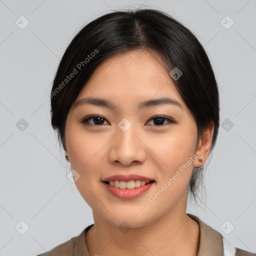 Joyful asian young-adult female with medium  black hair and brown eyes