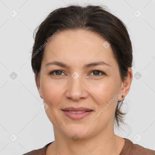 Joyful white adult female with short  brown hair and brown eyes