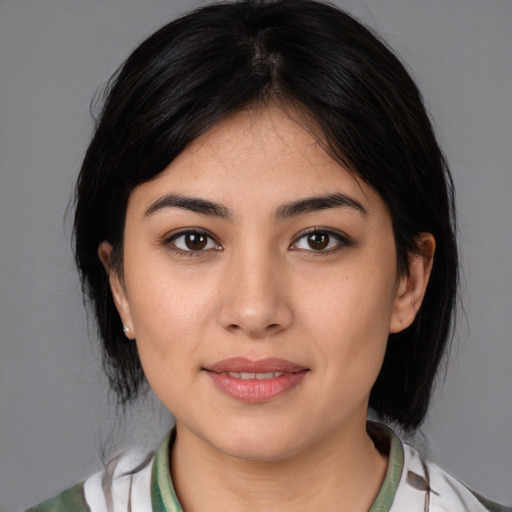 Joyful white young-adult female with medium  black hair and brown eyes