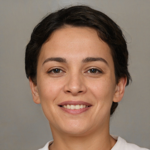 Joyful white young-adult female with short  brown hair and brown eyes