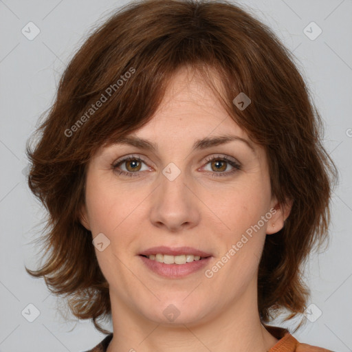 Joyful white young-adult female with medium  brown hair and green eyes