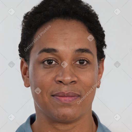 Joyful black adult female with short  brown hair and brown eyes