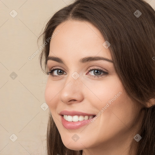 Joyful white young-adult female with long  brown hair and brown eyes