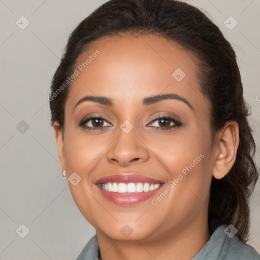 Joyful latino young-adult female with long  brown hair and brown eyes