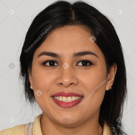 Joyful latino young-adult female with long  brown hair and brown eyes