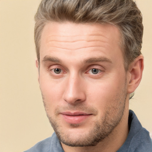 Joyful white adult male with short  brown hair and brown eyes