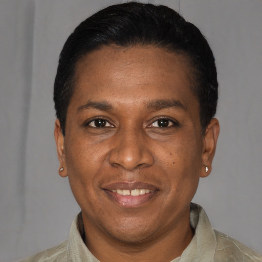 Joyful latino adult male with short  black hair and brown eyes