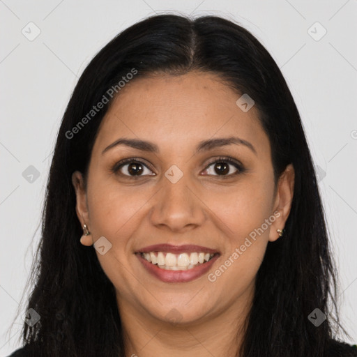 Joyful latino young-adult female with long  brown hair and brown eyes