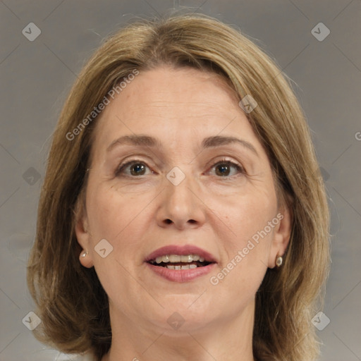 Joyful white adult female with medium  brown hair and brown eyes