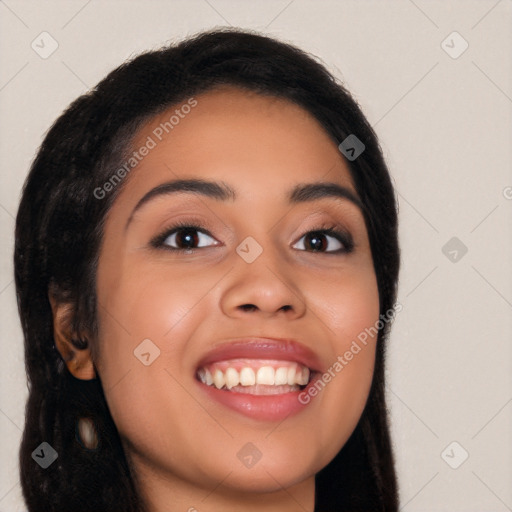 Joyful latino young-adult female with long  black hair and brown eyes