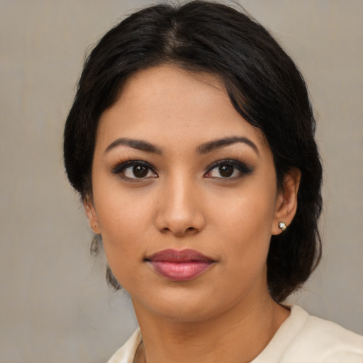 Joyful asian young-adult female with medium  brown hair and brown eyes