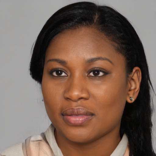 Joyful black young-adult female with medium  black hair and brown eyes