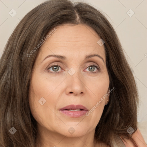 Joyful white adult female with long  brown hair and brown eyes