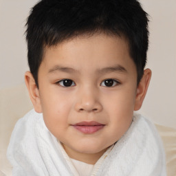 Joyful white child male with short  brown hair and brown eyes