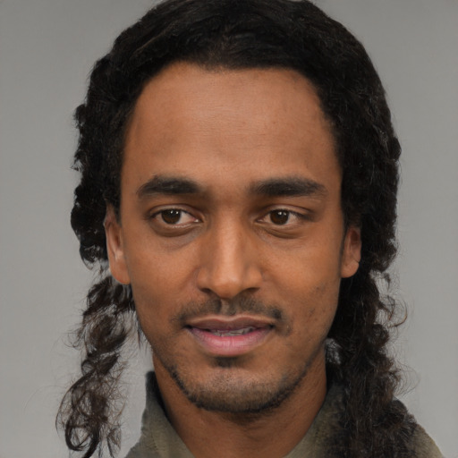 Neutral black young-adult male with long  black hair and brown eyes
