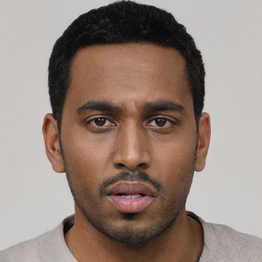 Neutral black young-adult male with short  black hair and brown eyes
