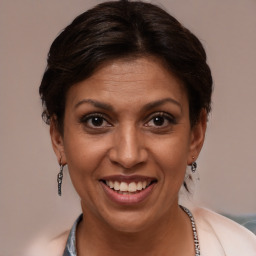 Joyful white adult female with medium  brown hair and brown eyes