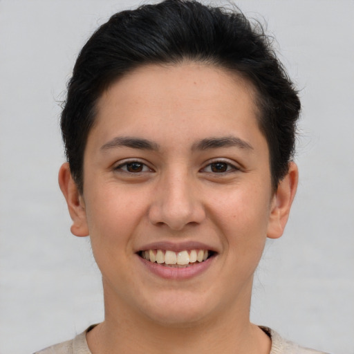 Joyful white young-adult female with short  brown hair and brown eyes