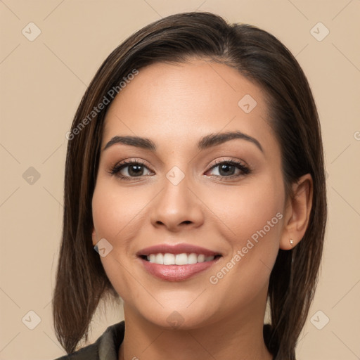 Joyful white young-adult female with long  brown hair and brown eyes