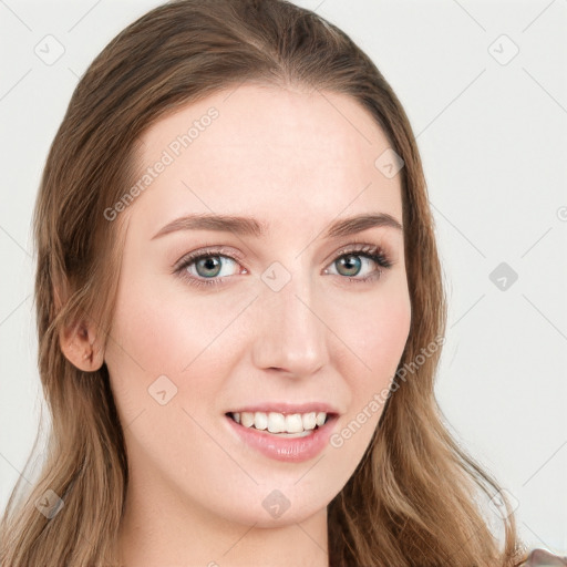 Joyful white young-adult female with long  brown hair and blue eyes