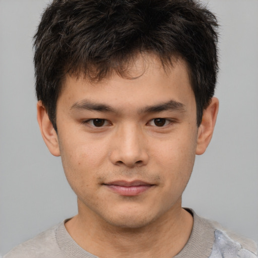 Joyful white child male with short  brown hair and brown eyes
