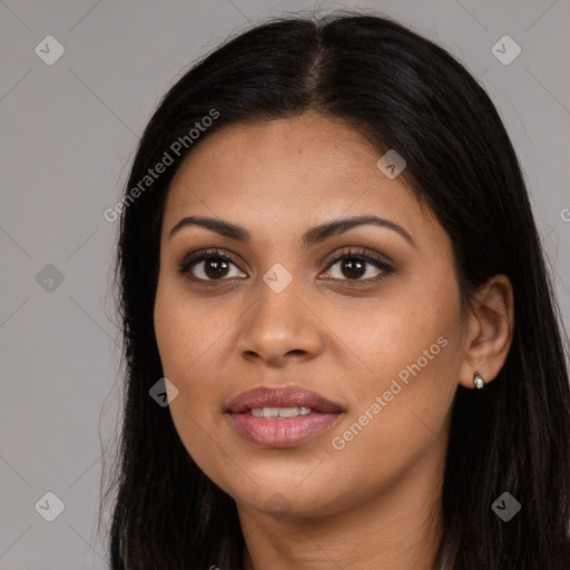 Joyful latino young-adult female with long  brown hair and brown eyes