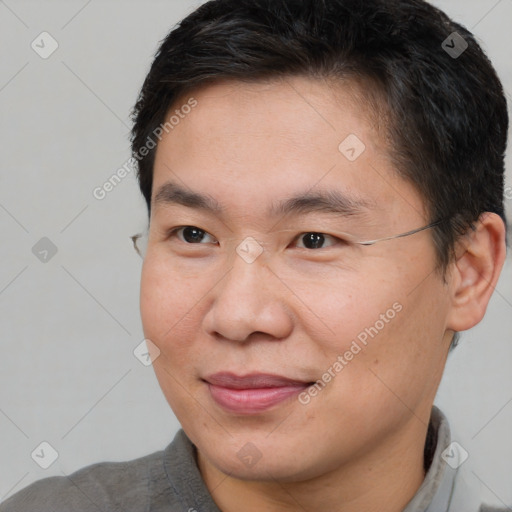 Joyful white adult male with short  brown hair and brown eyes