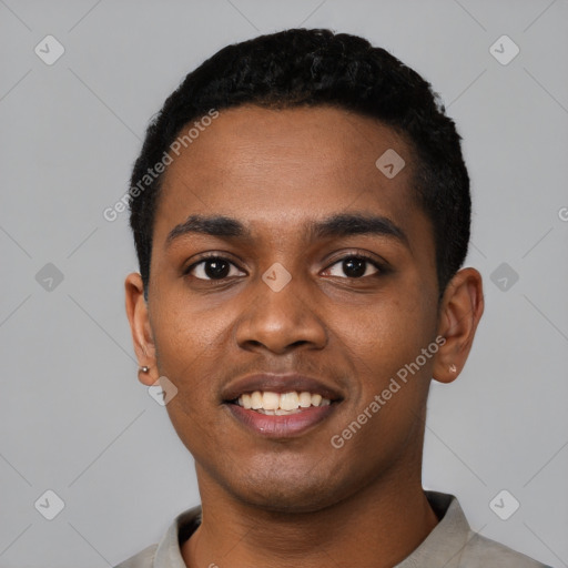 Joyful black young-adult male with short  black hair and brown eyes
