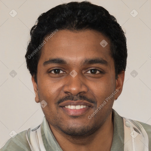 Joyful black young-adult male with short  black hair and brown eyes