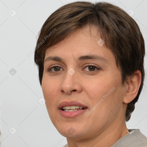 Joyful white adult female with short  brown hair and brown eyes