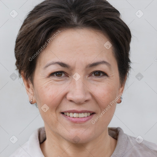 Joyful white adult female with short  brown hair and brown eyes