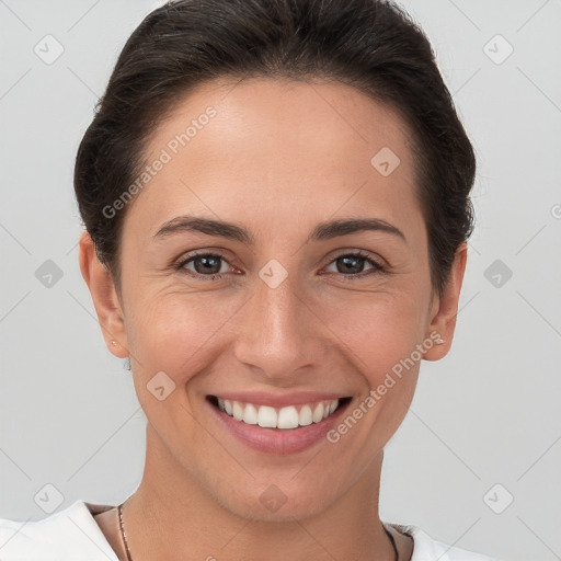 Joyful white young-adult female with short  brown hair and brown eyes