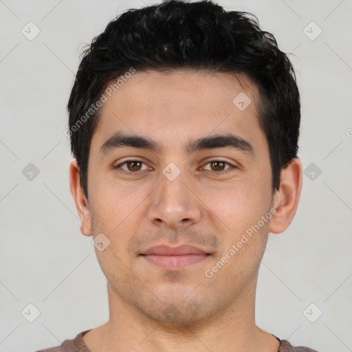 Joyful white young-adult male with short  black hair and brown eyes