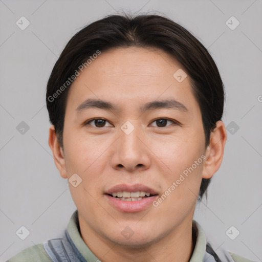 Joyful asian young-adult male with short  brown hair and brown eyes