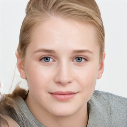Joyful white young-adult female with short  brown hair and blue eyes
