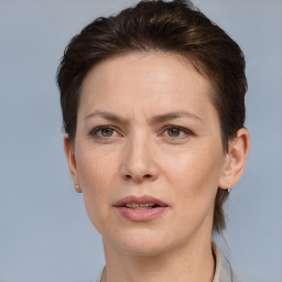 Joyful white adult female with short  brown hair and brown eyes