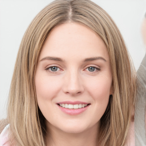 Joyful white young-adult female with long  brown hair and grey eyes