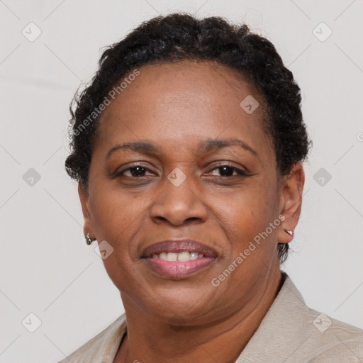 Joyful black adult female with short  brown hair and brown eyes