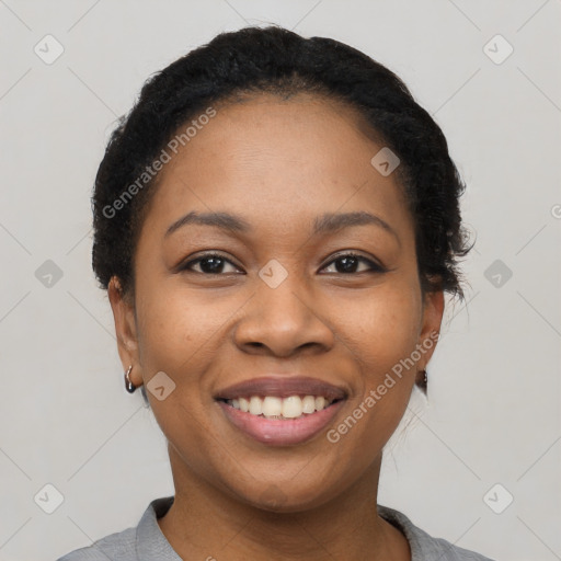 Joyful latino young-adult female with short  black hair and brown eyes