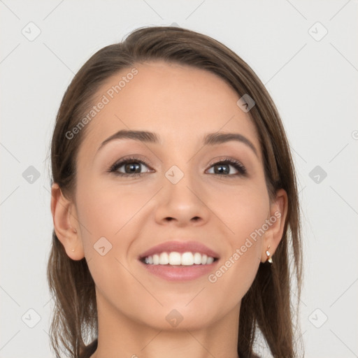 Joyful white young-adult female with long  brown hair and blue eyes